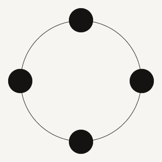 Four grey dots rotating in a circle